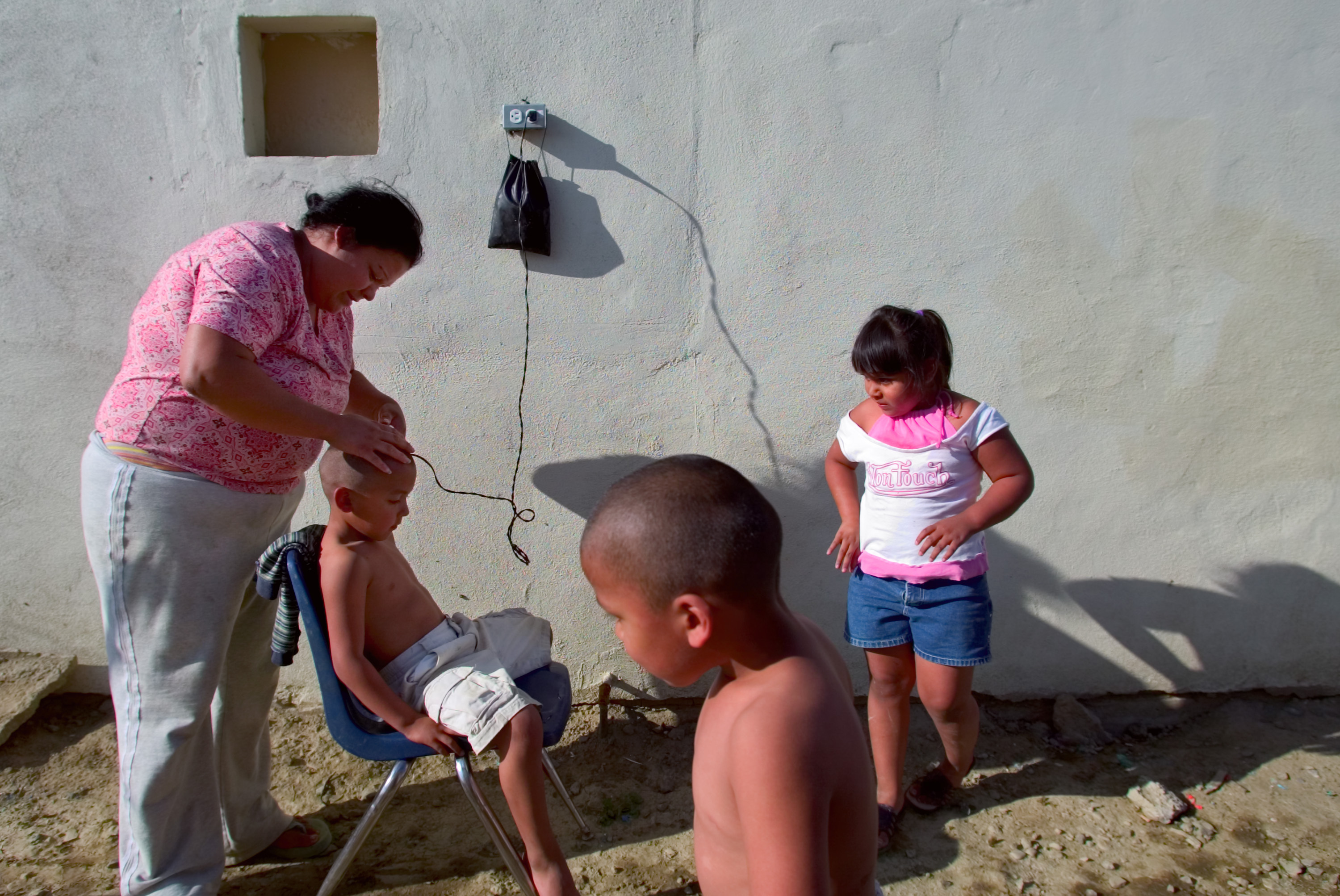 Boy getting a haircut in Huron California.