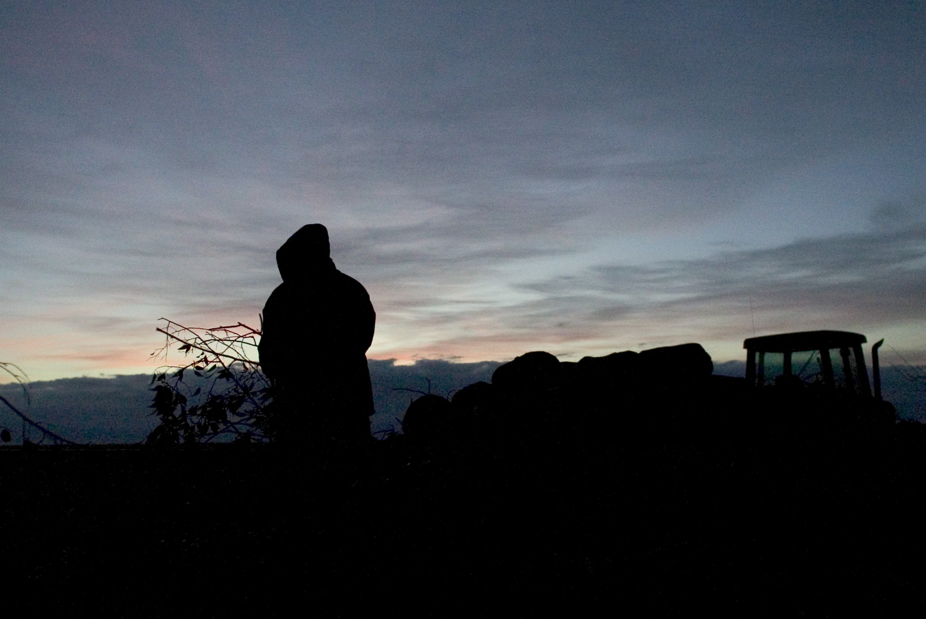 A man is silhouetted in the early morning hours near Huron, California. 2007